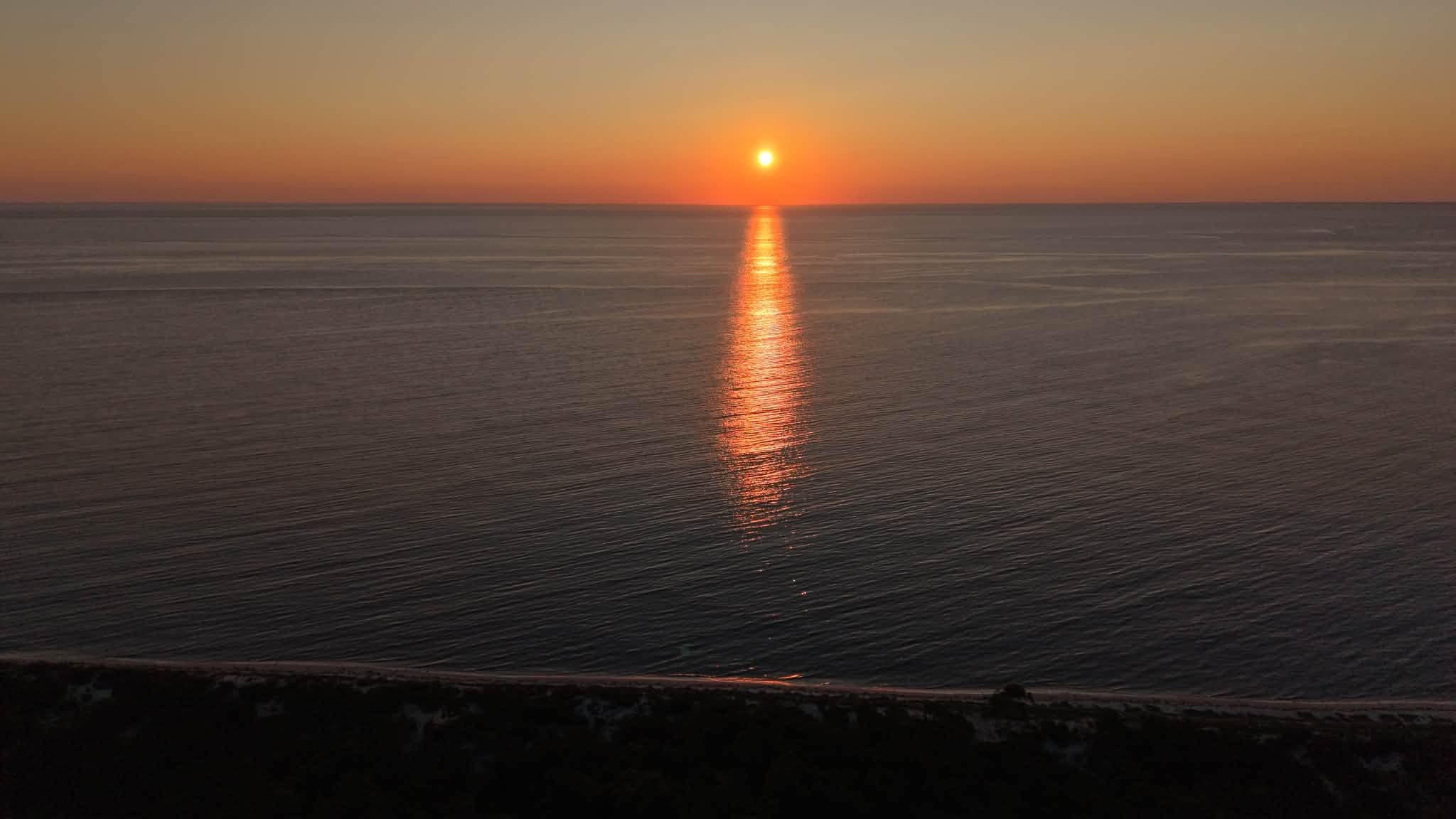 Aerial view of the sun setting over the Atlantic Ocean off the South Jersey coast